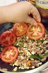 Build layers in a 2 qt. casserole: half the corn/beef mixture, then sliced tomatoes and repeat.