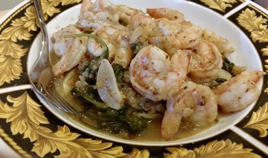 Finished bowl of spicy mustard shrimp searved in pasta bowl