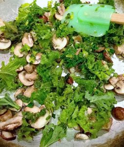 Coconut oil, green onions, baby portabella mushrooms and fresh kale leaves... sauteed down a bit.
