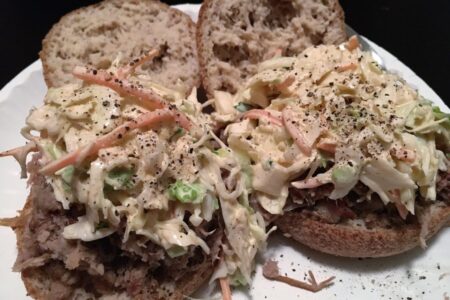 Low Carb Coleslaw served on low carb english muffins on white paper plate