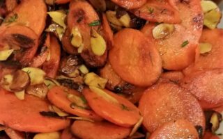 Close-up view of finished carrots almondine