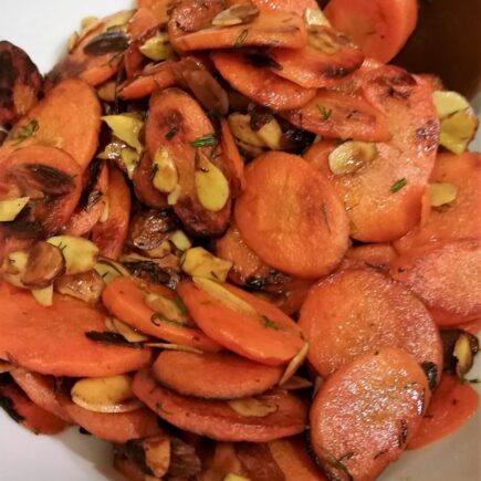 Close-up view of finished carrots almondine
