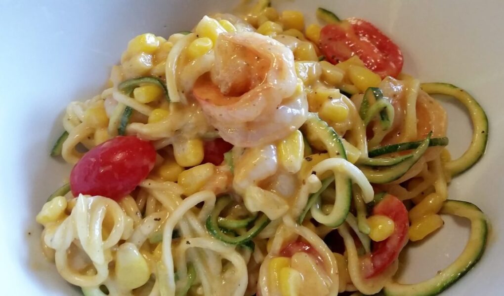 Persimmon Shrimp Pasta Salad seved in white bowl