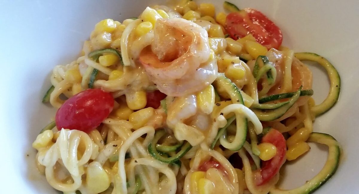 Persimmon Shrimp Pasta Salad seved in white bowl